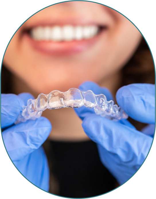 Close Up Of Woman Doctor Holding Invisalign Clear Aligner