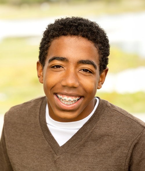 Smiling Teen Wearing Metal Braces in St. Louis, MO