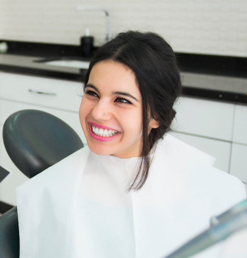 Smiling Woman In Orthodontist Chair