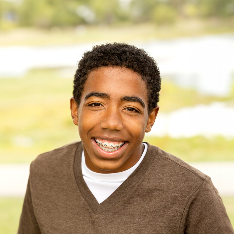 Young Smiling Boy Wearing Braces