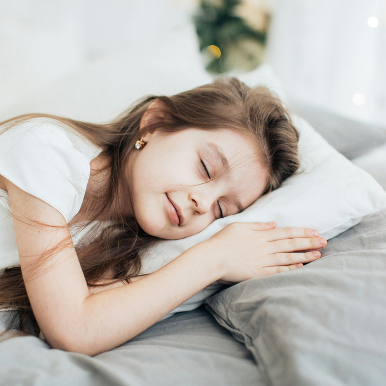 Smiling Sleeping Girl In Bed