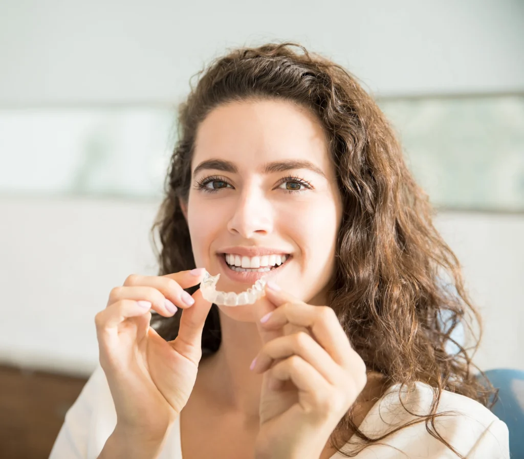 Woman about to put in her aligner